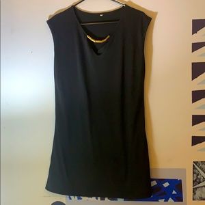 Black mini dress with gold accents